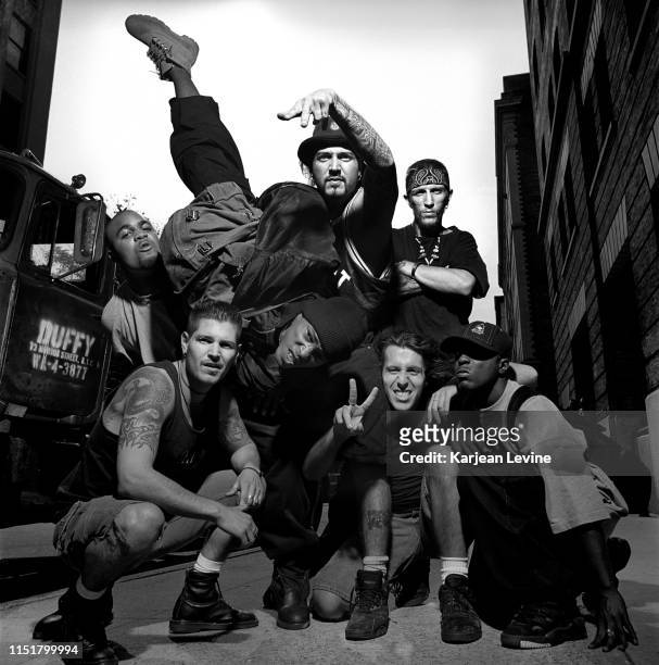 Hardcore band Biohazard pose with members of hip-hop group Onyx on a Greenwich Village street on August 13, 1993 in New York City, New York following...