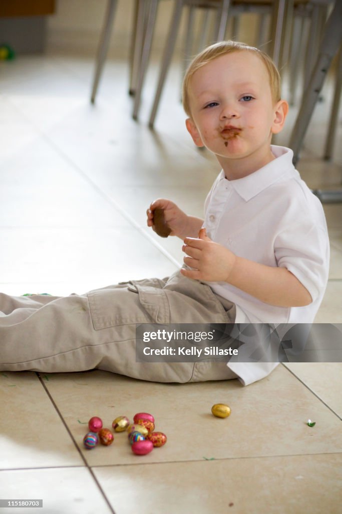 Toddler boy eating Easter chocolate