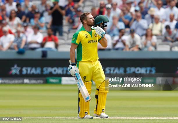 Australia's captain Aaron Finch celebrates after scoring a century during the 2019 Cricket World Cup group stage match between England and Australia...