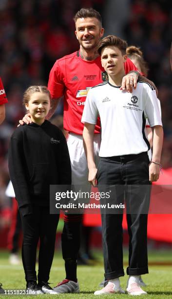 David Beckham of Manchester United '99 Legends pictured with his children Harper and Cruz during the Manchester United '99 Legends and FC Bayern...