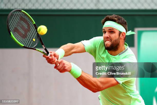 Jiri Veseley of The Czech Republic plays a backhand in the mens singles first round match against Leonardo Mayer of Argentina during Day one of the...