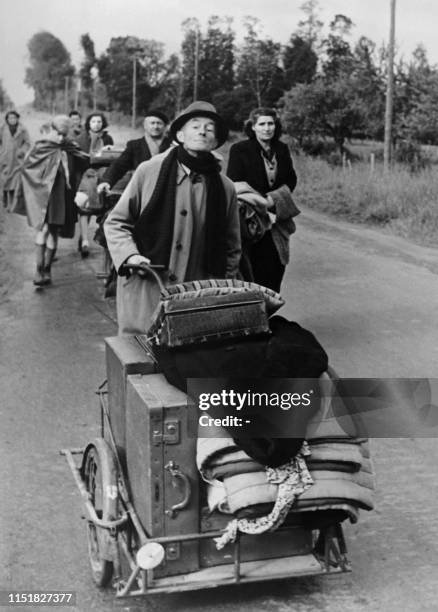 Undated picture taken on May-June 1940 near Paris showing civilian people on the road fleeing with their belongings the German troops.