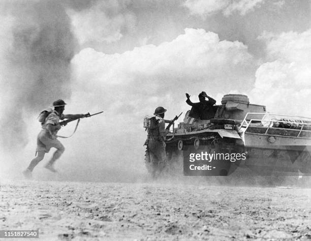 Undated picture taken on 1943 in the North African desert showing the surrender of a German Wehrmacht tank's team to English soldiers.