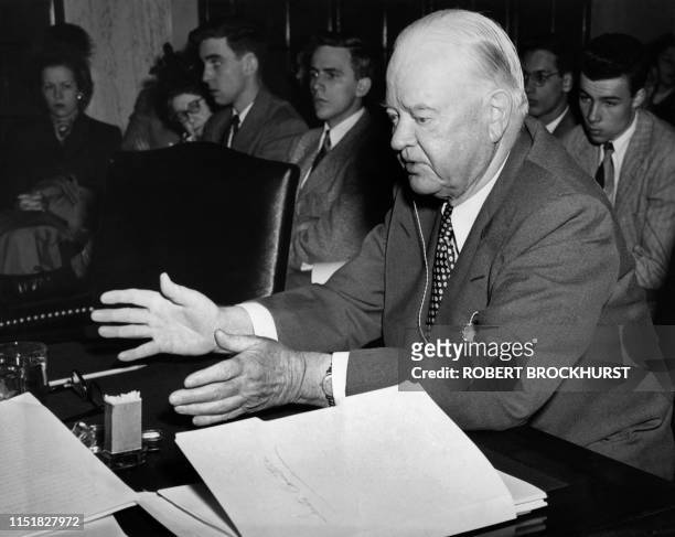 Picture taken on April 11, 1949 at Washington showing former American President Herbert Hoover speaking before the Senate commettee on the government...