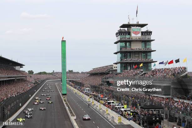 Simon Pagenaud of France, driver of the Menards Team Penske Chevrolet leads the field at the start of the 103rd running of the Indianapolis 500 at...