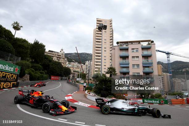 Lewis Hamilton of Great Britain driving the Mercedes AMG Petronas F1 Team Mercedes W10 leads Max Verstappen of the Netherlands driving the Aston...