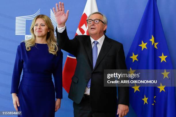 President of the European Commission Jean-Claude Juncker waves as he welcomes Slovakia's President Zuzana Caputova at the European Commision...