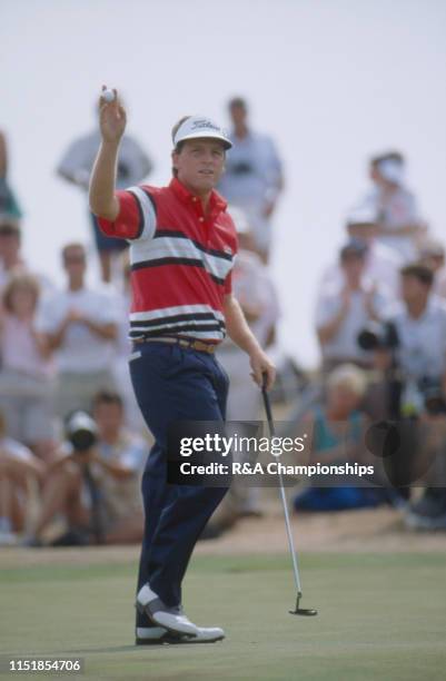 Mark Calcavecchia of the United States acknowledges the crowd on the 18th green during The 118th Open Championship held at Royal Troon Golf Club from...