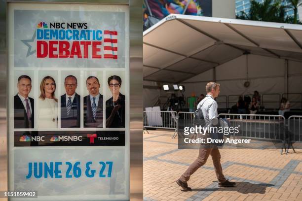 An advertisement touts the first Democratic presidential primary debates for the 2020 elections outside the Adrienne Arsht Center for the Performing...
