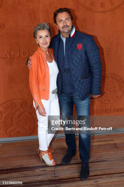 Henri Leconte and Maria Dowlatshahi attend the 2019 French Tennis Open - Day One at Roland Garros on May 26, 2019 in Paris, France.