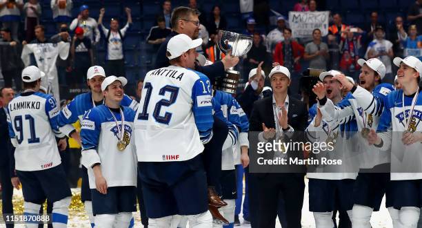Jukka Jalonen, head coach of Finland celebrate with the trophy after winning the gold medal game over Canada during the 2019 IIHF Ice Hockey World...