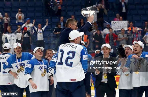 Jukka Jalonen, head coach of Finland celebrate with the trophy after winning the gold medal game over Canada during the 2019 IIHF Ice Hockey World...