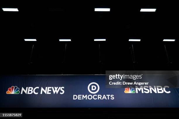 Advertising signage for NBC News and the Democratic Party is seen inside the media filing center at Adrienne Arsht Center for the Performing Arts...