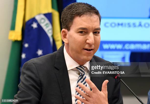 Journalist Glenn Greenwald, founder and editor of The Intercept website gestures during a hearing at the Lower House's Human Rights Commission in...