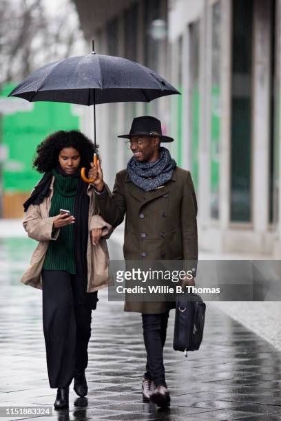 Black Business People on City Street Checking Smartphone