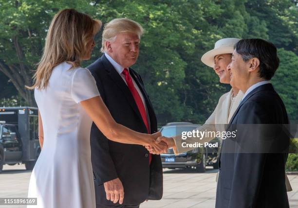 President Donald Trump and First Lady Melania Trump are greeted by Emperor Naruhito and Empress Masako as they arrive at the Imperial Palace on May...