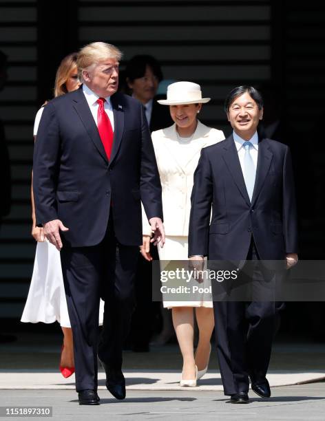 President Donald Trump and first lady Melania Trump are escorted by Japan's Emperor Naruhito and Empress Masako during an welcome ceremony at the...