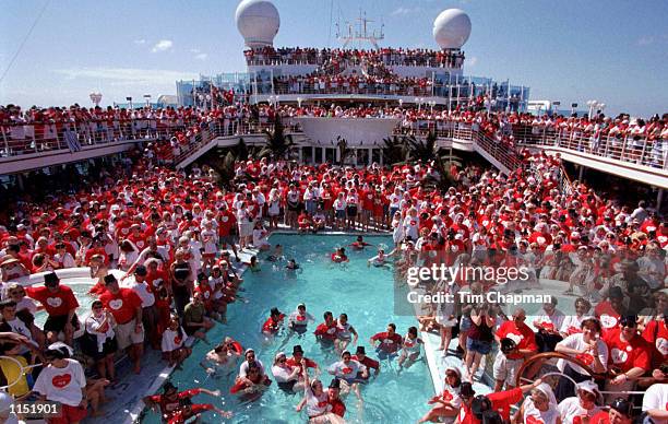 More than a thousand couples renew their vows at sea aboard Grand Princess, the largest cruise ship in the world on February 9, 1999. The "Love Boat...