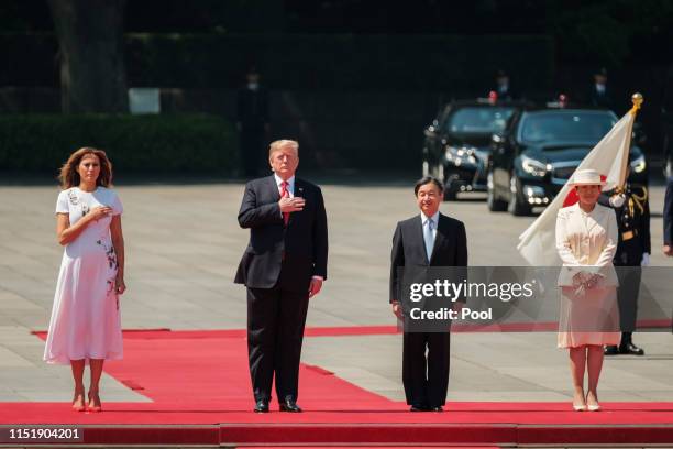 Melania Trump, U.S. President Donald Trump, Japan Emperor Naruhito and Empress Masako stand to listen National Anthem during a welcome ceremony at...