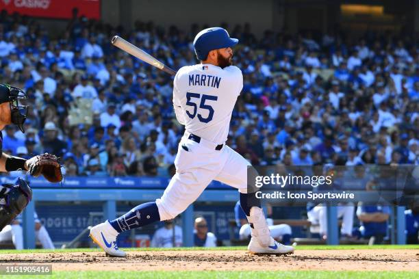 Los Angeles Dodgers catcher Russell Martin swings at a pitch during a MLB game between the Colorado Rockies and the Los Angeles Dodgers on June 22,...