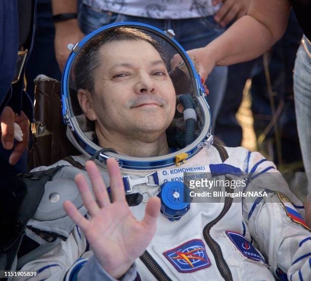 In this handout image provided by NASA, Expedition 59 crew member Oleg Kononenko of Roscosmos is seen outside the Soyuz MS-11 spacecraft after he,...