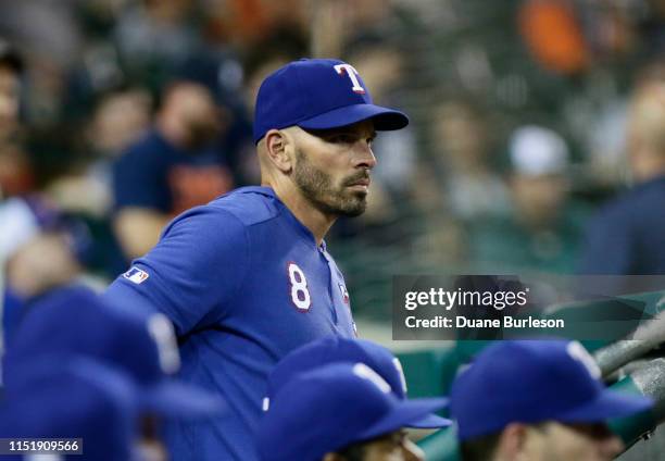 Manager Chris Woodward of the Texas Rangers watches from the dugout during the ninth inning of a game against the Detroit Tigers at Comerica Park on...