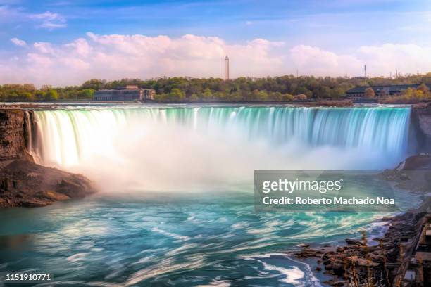 Daytime long exposure of the Horseshoe Waterfall in the Niagara River. The place is one of the most famous tourist attractions in North America....
