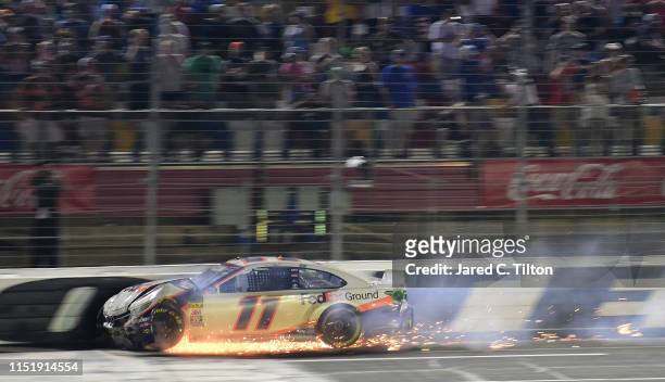 Denny Hamlin, driver of the FedEx Ground Toyota, crashes during the Monster Energy NASCAR Cup Series Coca-Cola 600 at Charlotte Motor Speedway on May...