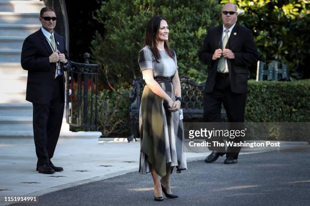 Stephanie Grisham, spokeswoman for first lady Melania Trump, watches as President Donald Trump and the first lady greet attendees during the annual...