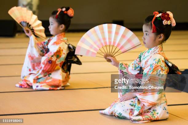 Children perform a traditional dance for U.S. First Lady Melania Trump and Akie Abe, wife of Japanese Prime Minister Shinzo Abe during a cultural...