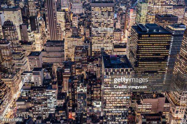 crowded skyscrapers in midtown manhattan - yongyuan usa stock pictures, royalty-free photos & images