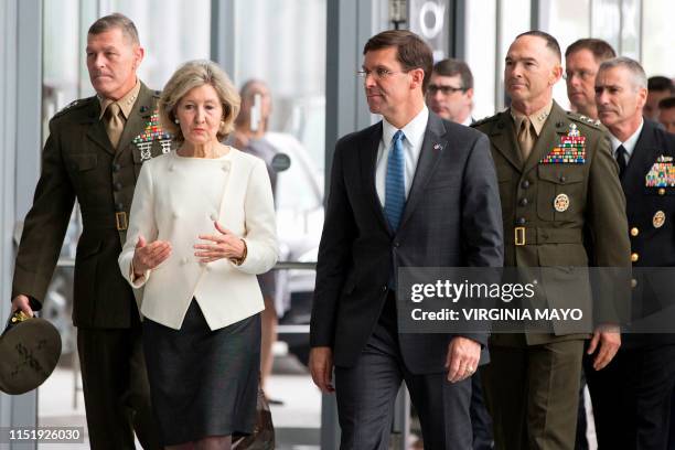 Ambassador to NATO Kay Bailey Hutchison speaks with acting US Secretary for Defense Mark Esper upon their arrival for a meeting of NATO defense...