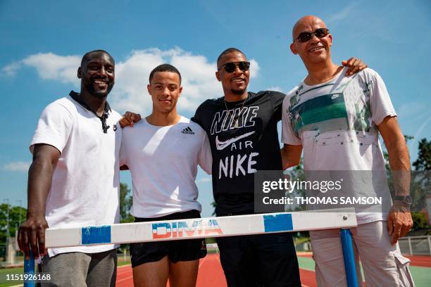 Australian-French athlete Sasha Zhoya poses with former French athlete Stephane Caristan , afte a training session coached by Ladji Doucoure , and...