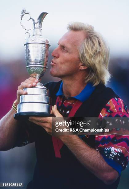 Greg Norman of Australia kisses the Claret Jug following his victory during the 122nd Open Championship held at Royal St George's Golf Club from July...