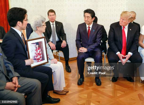President Donald Trump listens to Sakie Yokota , mother of Megumi Yokota who was kidnapped by North Korean agents at the age of 13 in 1977, as he...
