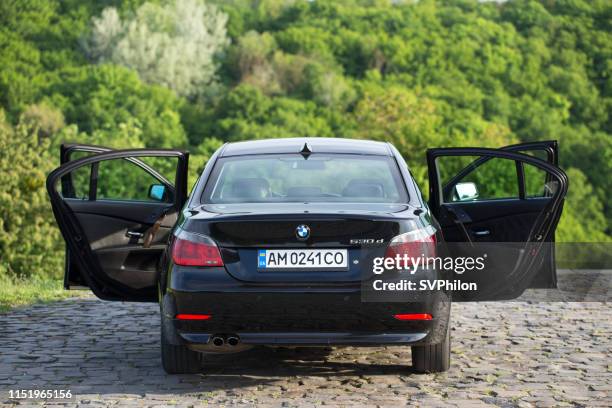 bmw 530d 5 series with open doors. - open day 5 stock pictures, royalty-free photos & images