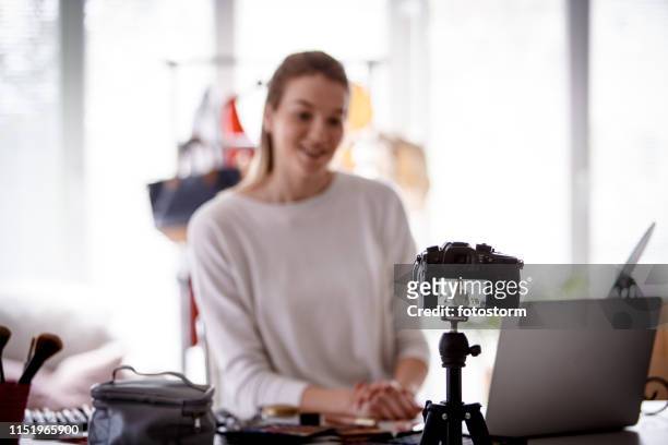selective focus at camera, makeup blogger recording video - photo shoot at home stock pictures, royalty-free photos & images