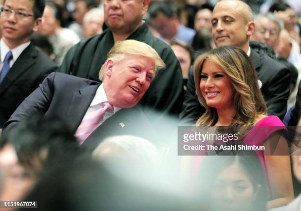 President Donald Trump and First Lady Melania Trump enjoy watching sumo bouts on day fifteen of the Grand Sumo May Tournament at Ryogoku Kokugikan on...