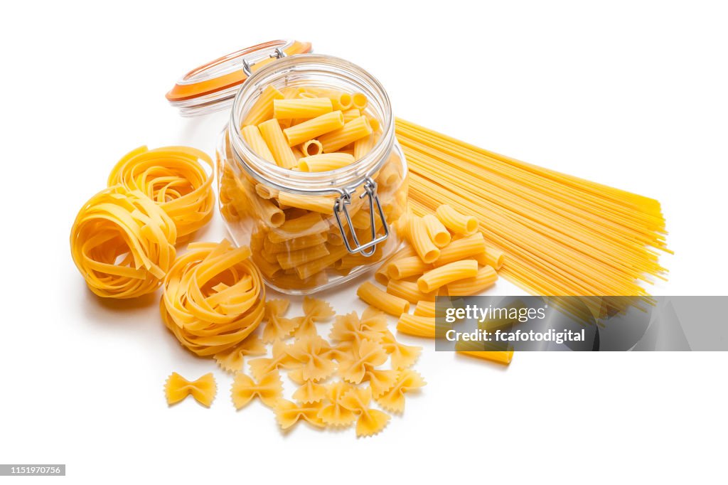 Various types of raw pasta isolated on white background