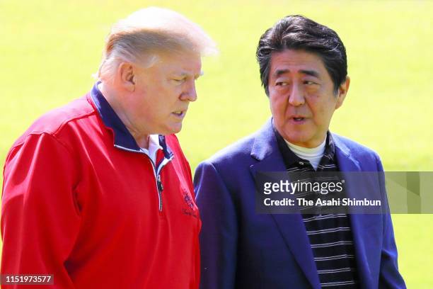 President Donald Trump talks with Japanese Prime Minister Shinzo Abe prior to playing golf at Mobara Country Club on May 26, 2019 in Mobara, Chiba,...