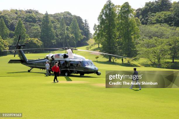 President Donald Trump is welcomed by Japanese Prime Minister Shinzo Abe prior to playing golf at Mobara Country Club on May 26, 2019 in Mobara,...