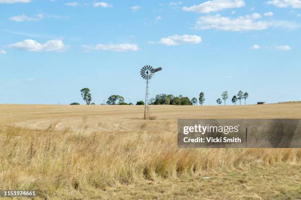 windmill out in the country - outback windmill stock pictures, royalty-free photos & images