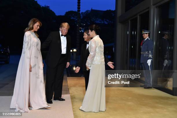 President Donald Trump and First Lady Melania Trump are greeted by Japan's Emperor Naruhito and Empress Masako upon their arrival at the Imperial...