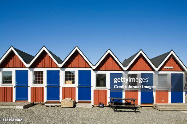 small huts on beach - båthus bildbanksfoton och bilder