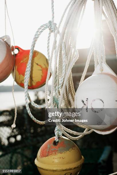 buoys hanging on boat - archipelago stockfoto's en -beelden