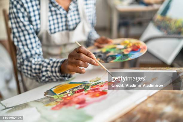 female artist working in studio - arts and crafts supplies stock pictures, royalty-free photos & images