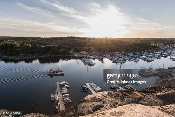 sunset over harbour - förtöjd bildbanksfoton och bilder