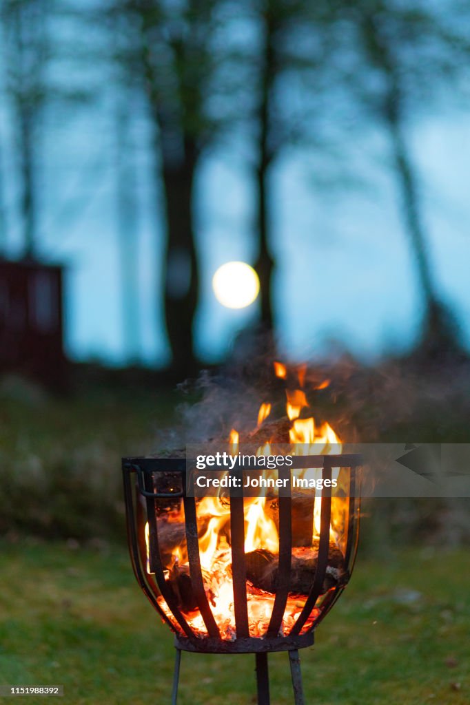 Firewood burning in metal container