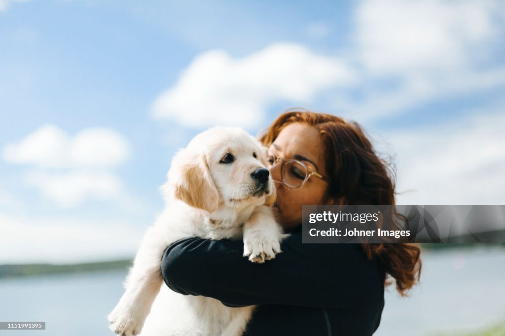 Woman carry puppy