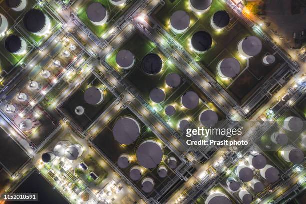 aerial view oil terminal is industrial facility for storage of oil and petrochemical products ready for transport to further storage facilities. - oil refinery stock pictures, royalty-free photos & images
